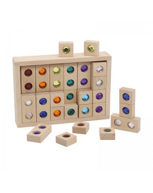 wooden building blocks with sparkling, colourful gems